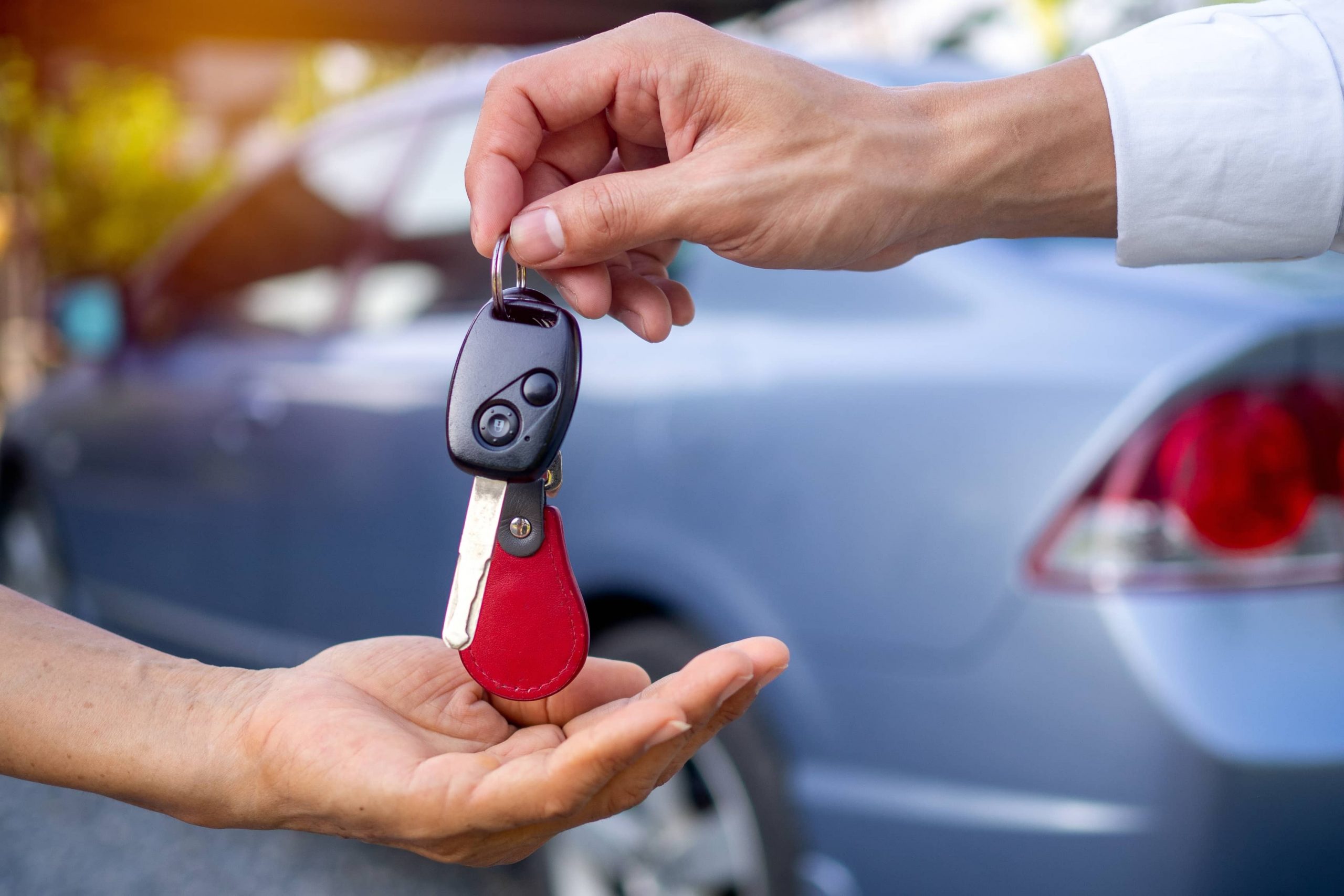Passing car keys to buyer