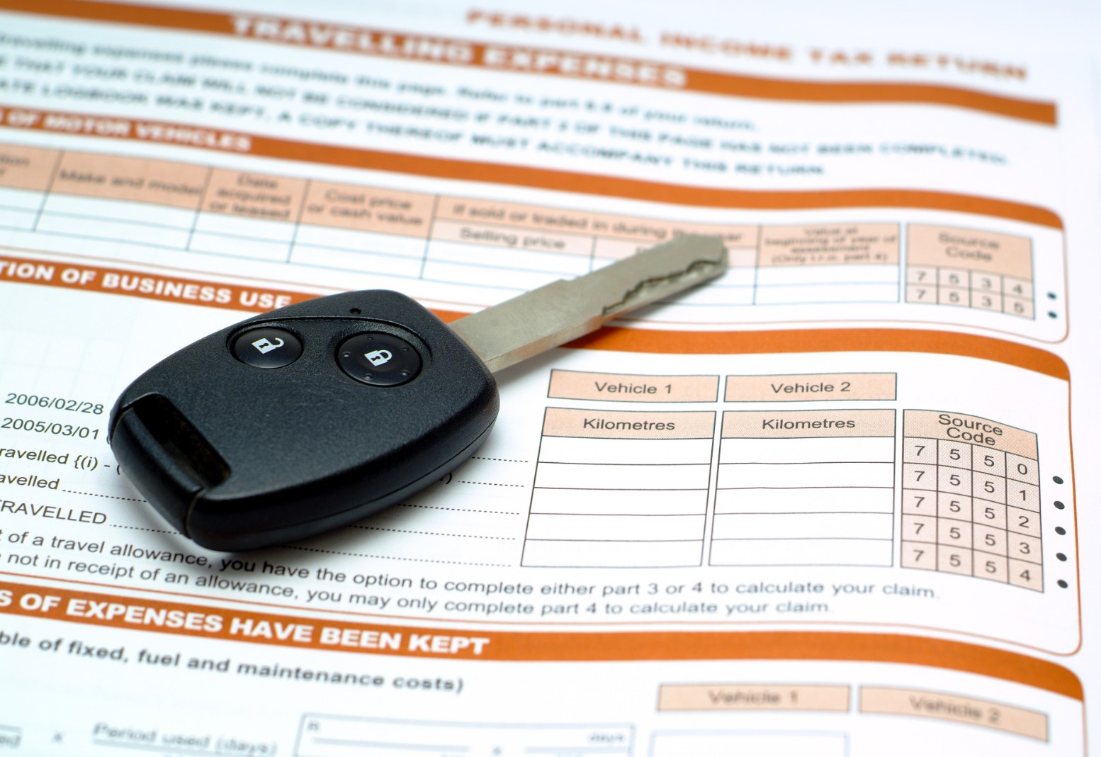 Car keys on car tax form