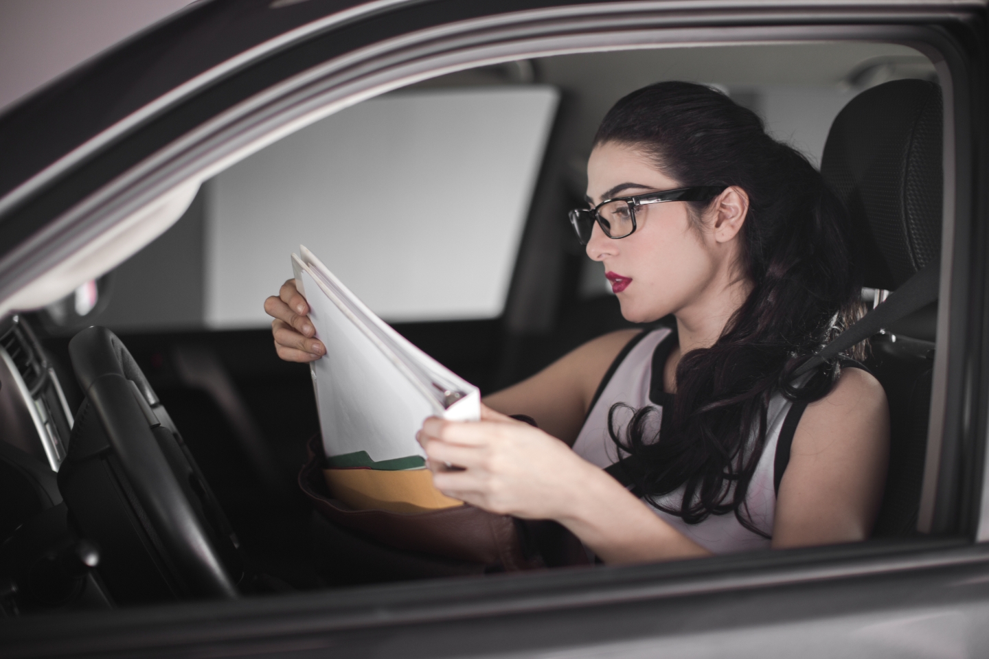 Woman checking car documents