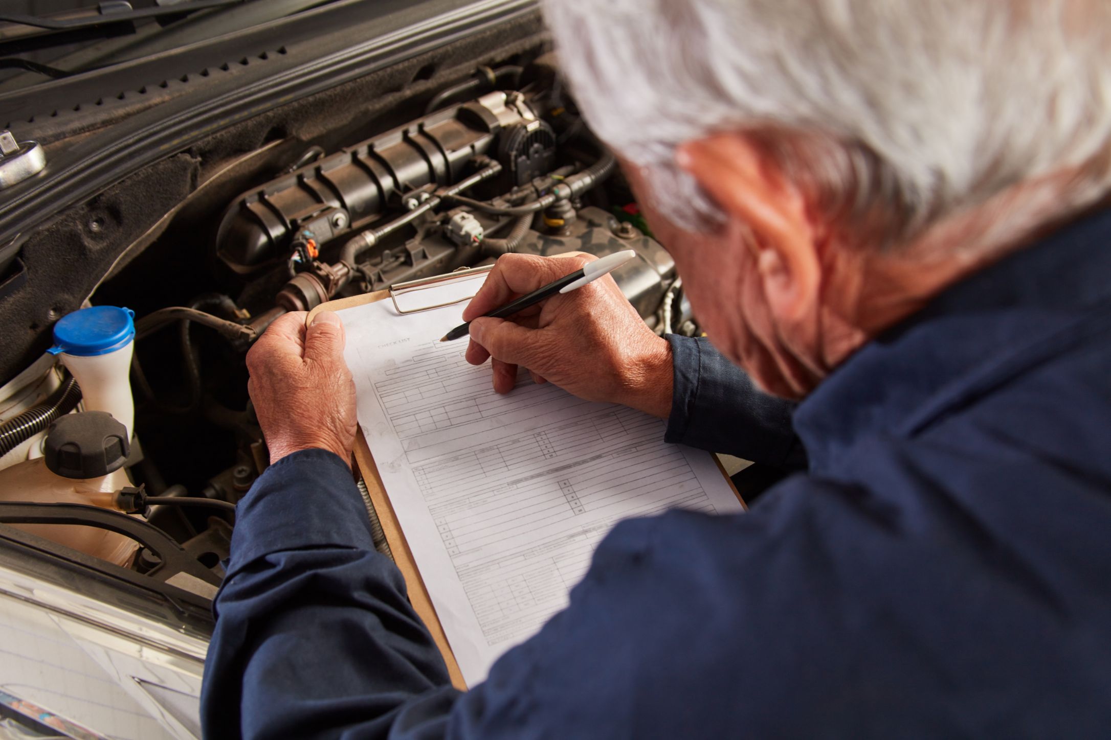 Car mechanic conducting an inspection