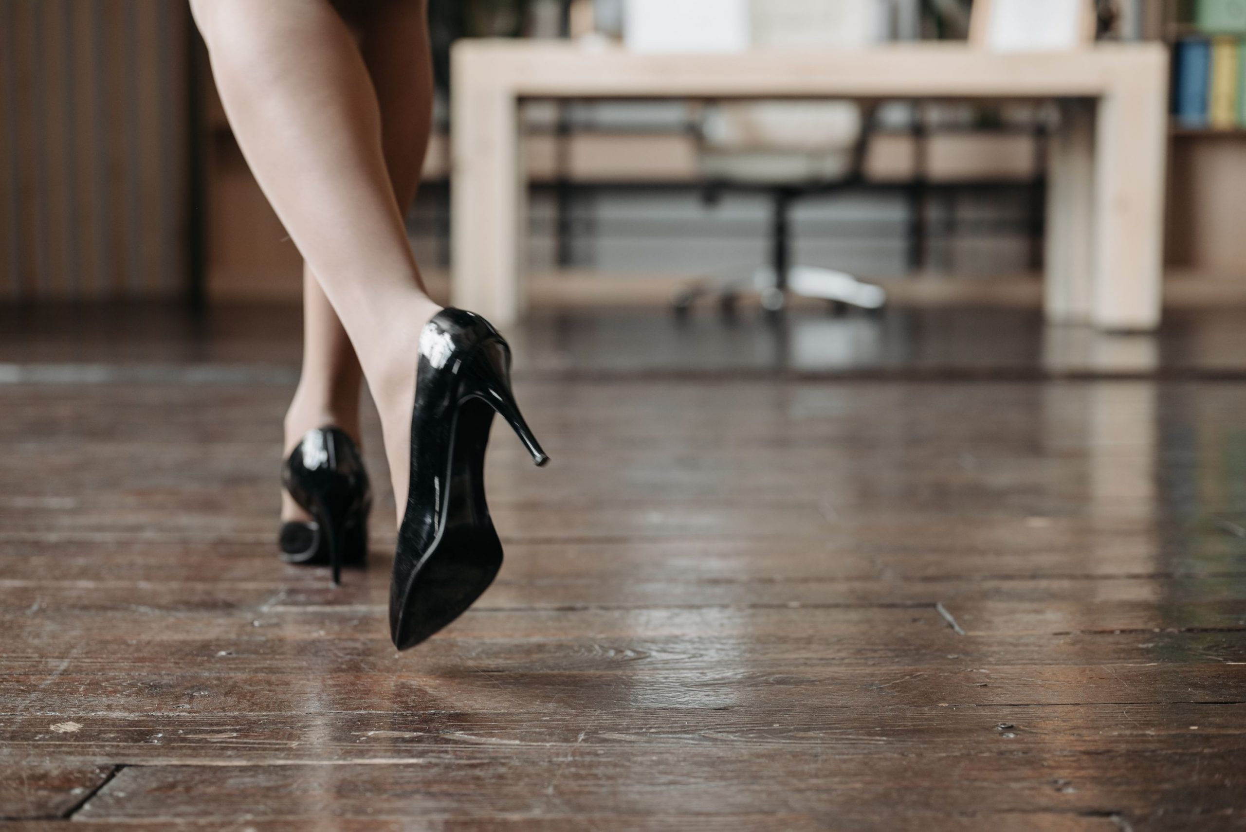 Woman walking away wearing heels